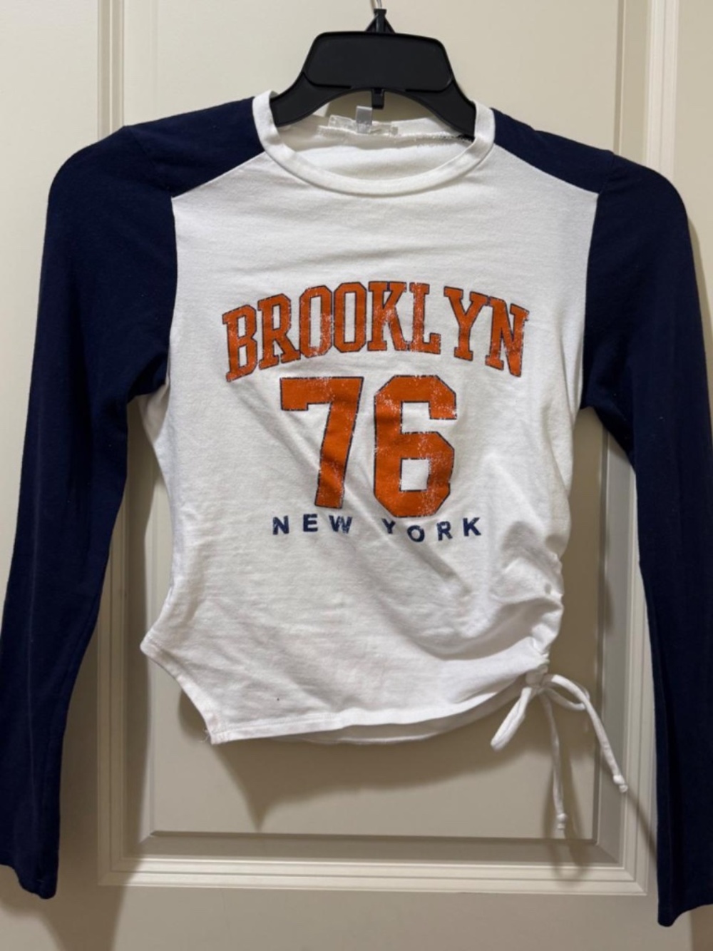 Medium navy and white baseball long sleeve shirt with Brooklyn, New York in Oran